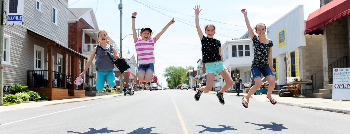 kids jumping on main street