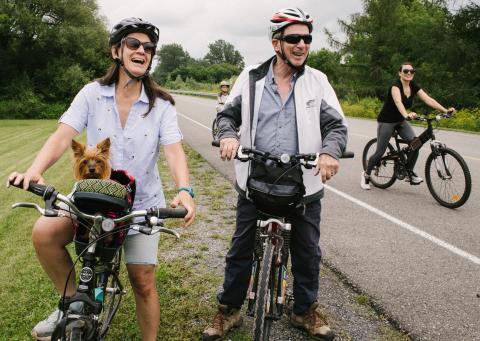 A family cycles on a local trail.