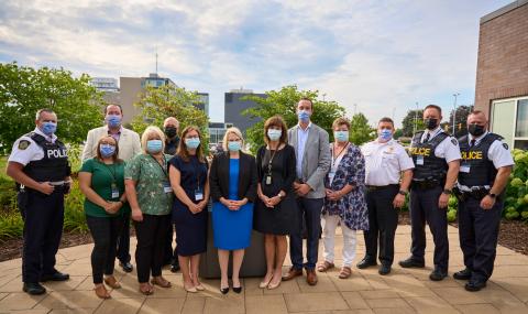 Hon. Sylvia Jones, Deputy Premier and Minister of Health, poses alongside stakeholders and community partners at an announcement event for the new Safe Bed Program, held at Cornwall Community Hospital on August 17, 2022. Pictured left to right: Deputy Chief Vince Foy (Cornwall Police Service), Councillor Carilyne Hébert (City of Cornwall), Grand Chief Abram Benedict (Mohawk Council of Akwesasne), Shawn McMartin (Riverview Manor), Staff Sergeant Greg Smith (Ontario Provincial Police, SDG Detachment), Board C