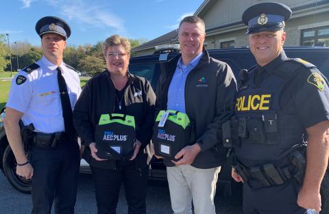Showing off the new defibrillators are, from left, SDG OPP Detachment Commander Marc Hemmerick, SDG Warden Carma Williams, SDG CAO Tim Simpson and OPP Acting Sgt. Greg Smith.