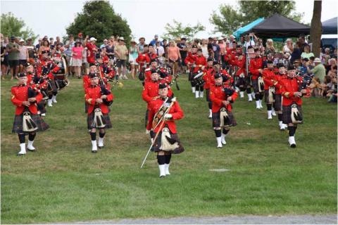 Performers march onto the field at the Glengarry Highland Games.