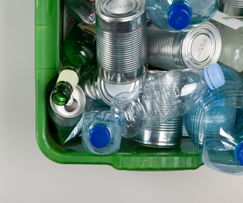 Recycling box with empty bottles and cans.