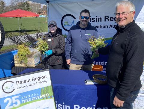 RRCA's Jessica Herrington (left) and OPG's Matthew Mulvihill offering 1000 free trees to local residents during the City of Cornwall's Eco Day on April 20, 2024.