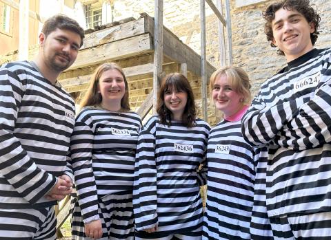 Tourism students standing in front of the gallows at the sdg jail
