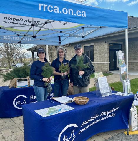From left: SNC Communications Specialist, Erin Thorne; RRCA Administrative Assistant, Josianne Sabourin; and local resident, Ray Beauregard, at a 2024 Tree Giveaway event at the South Stormont municipal office.