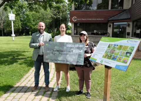From left: local TD Branch Manager, Mike Duval, presents a cheque to RRCA's General Manager / Secretary-Treasurer, Alison McDonald, and Public Information Coordinator, Claudia Munafo, for enhancements to the native plant demonstration site at Gray's Creek Conservation Area.